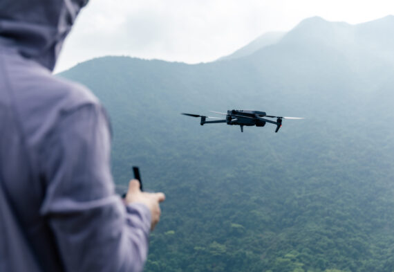 Flying drone in spring forest Flying drone in spring forest